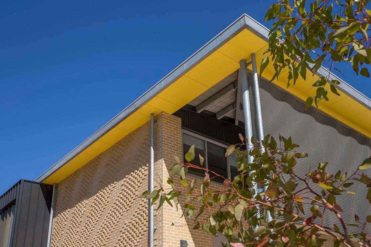 Rhythm and Flow — Integrated brick, glazing and aluminium louvres, Yanchep Secondary College