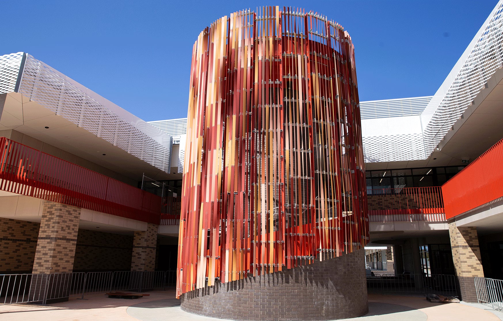 Anthesis nears completion at Piara Waters Secondary College, its fin clad drum rising from a spiral brick base