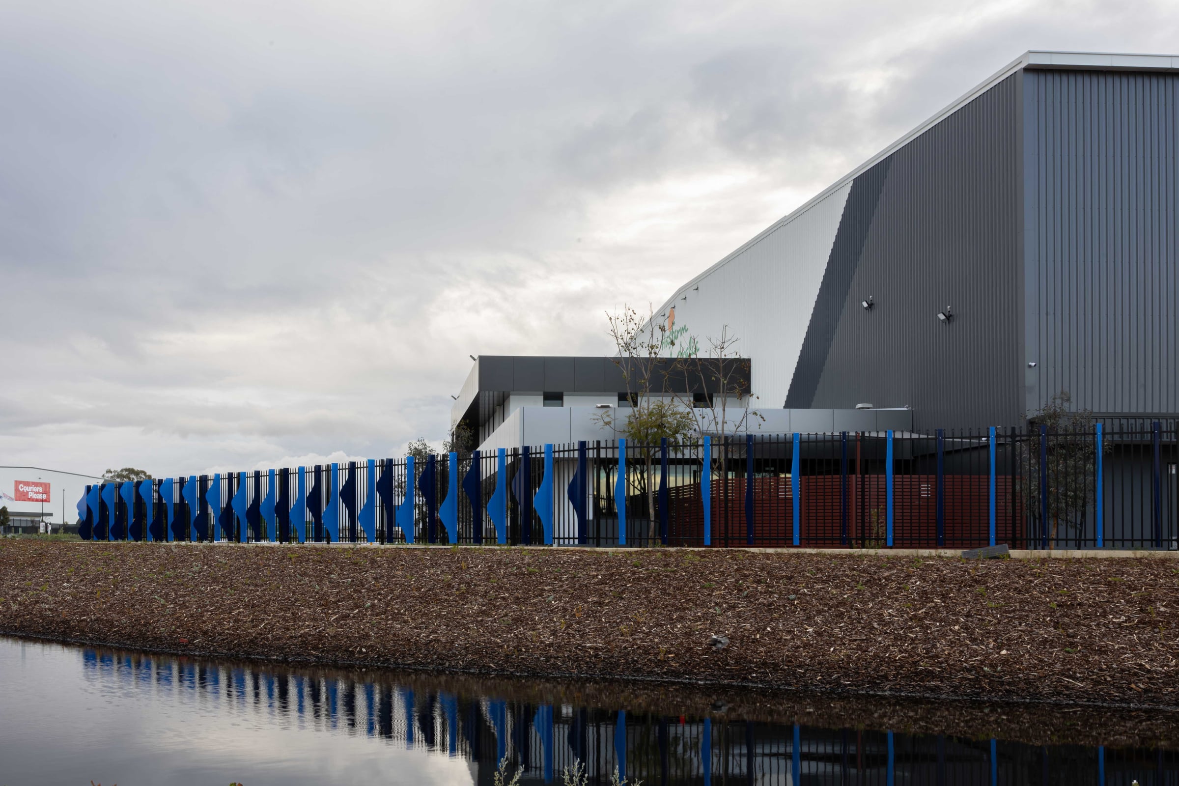 Streetscape view of the Lynch warehouse frontage with Cascading Creeks fins running its full length, Hazelmere.